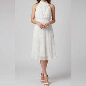 White summer dress with pleated skirt